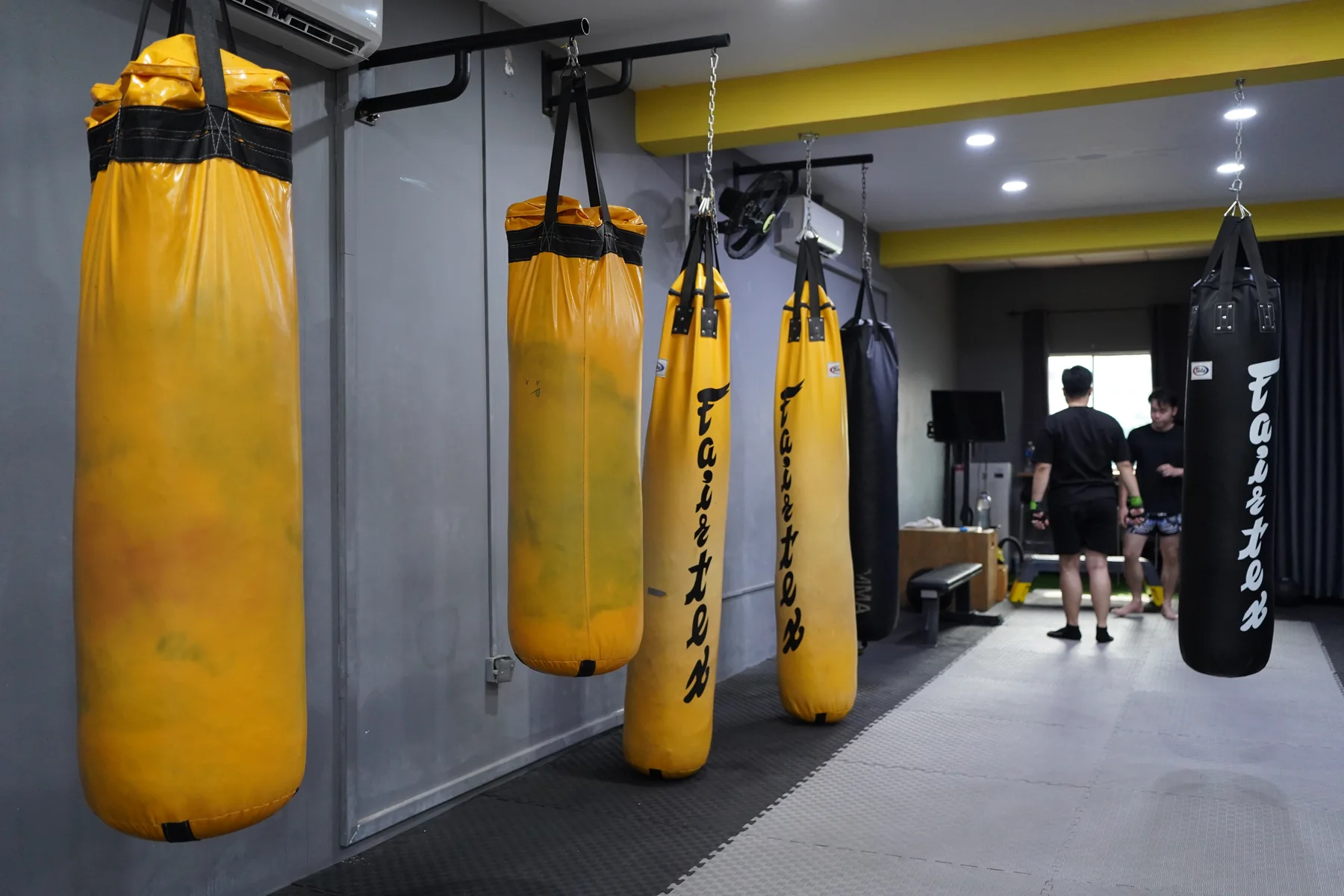 The bag row at the Fitcom Muay Thai gym in Taman Kota Laksamana, Melaka