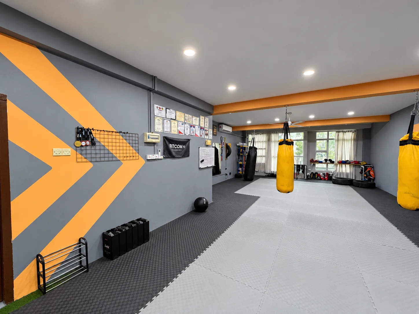 The open training floor at the Fitcom Muay Thai gym, Melaka